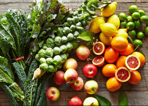 a group of fruits and vegetables on a wood surface Healthy Weight Loss Diets Clydebank
